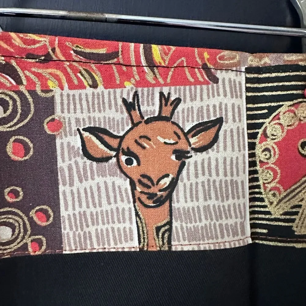 NWT Pair of Cloth Napkins from Africa. Plain black with printed lined edge 16.5”